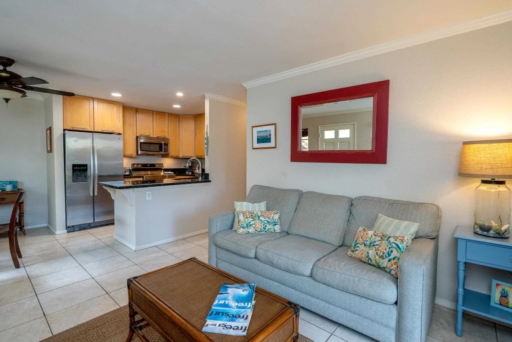 Living area inside Kihei Villages Unit 26-103 with hard surface flooring and natural light