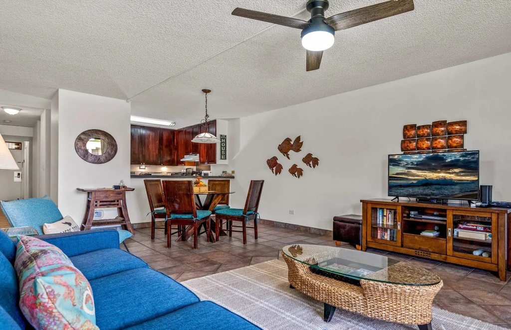 Living room with tiled flooring inside Kamaole Sands 7-108 in Kihei Maui
