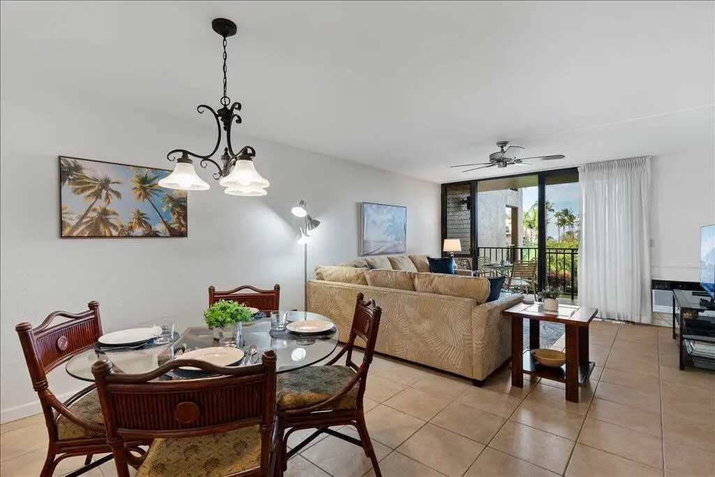 Bright living area with tile flooring inside Kamaole Sands 5-205 in Kihei