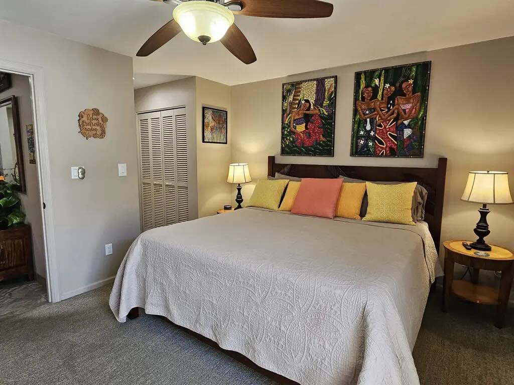 Furnished bedroom inside the one-bedroom Maui Kamaole F-102 condo