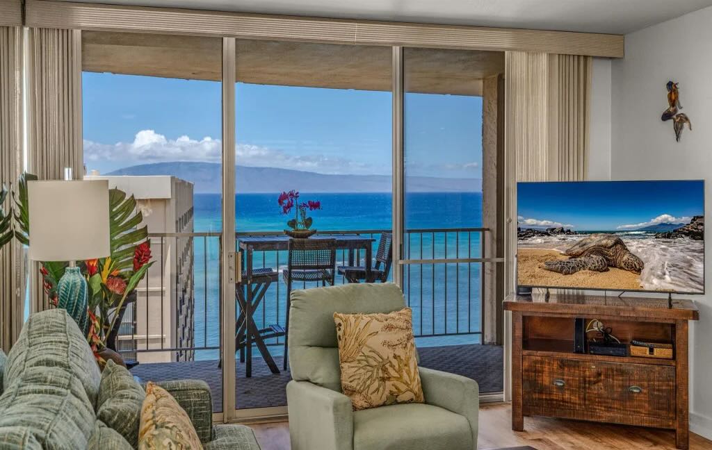 Remodeled living area with ocean views inside Royal Kahana 1215 in West Maui