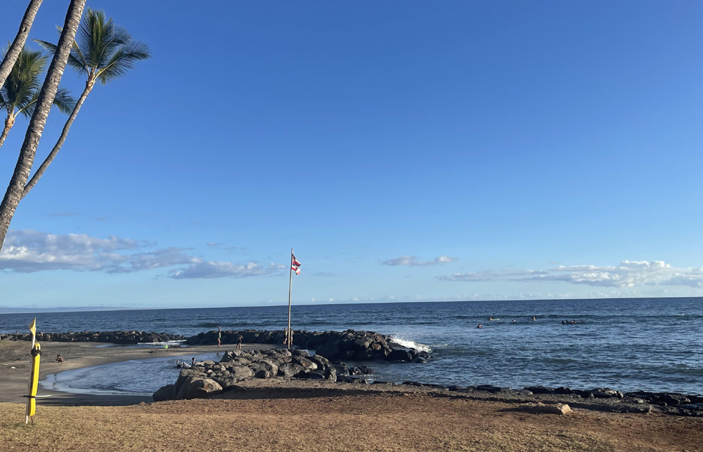 Calm shoreline and gentle surf near a family-friendly Maui beach
