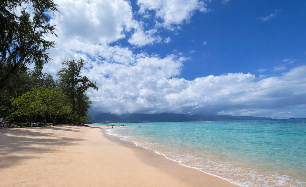 Wide sandy shoreline at Kanaha Beach Park in Kahului Maui
