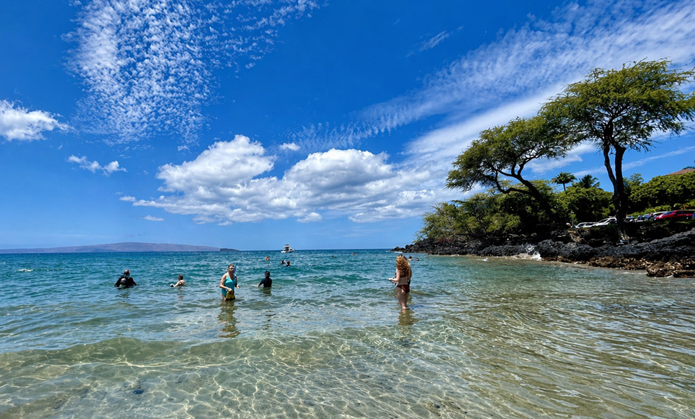 Makena Landing shoreline in South Maui with clear water, lava rock, and ocean views